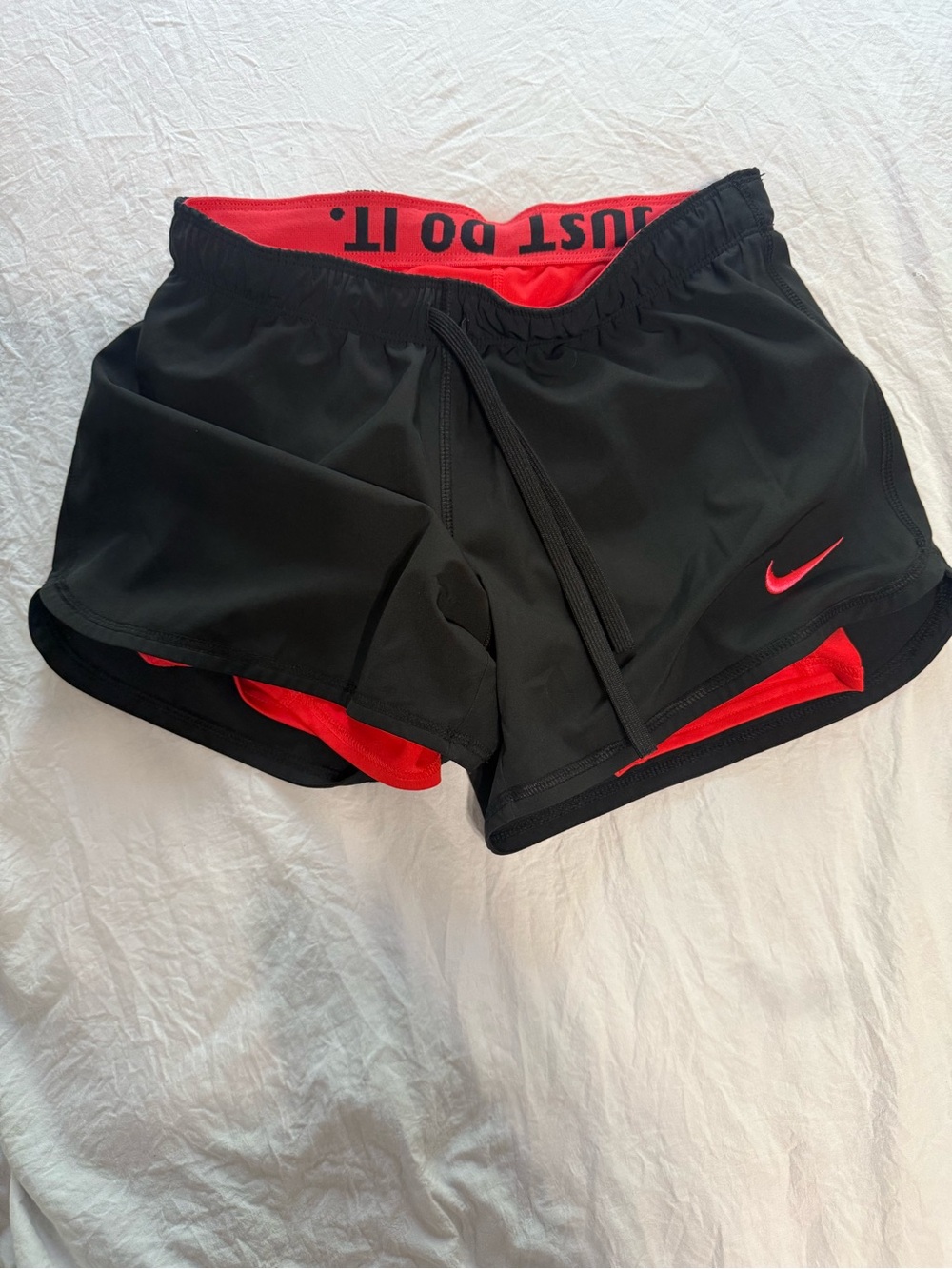 Nike Women’s Black Shorts with orange Accents